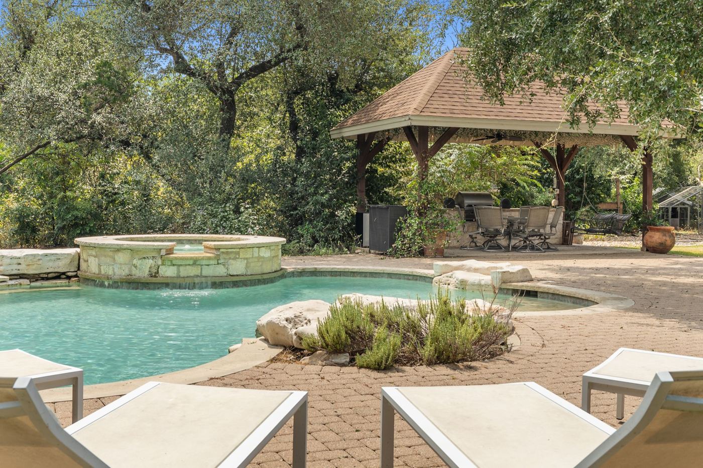 Poolside loungers facing the spa
