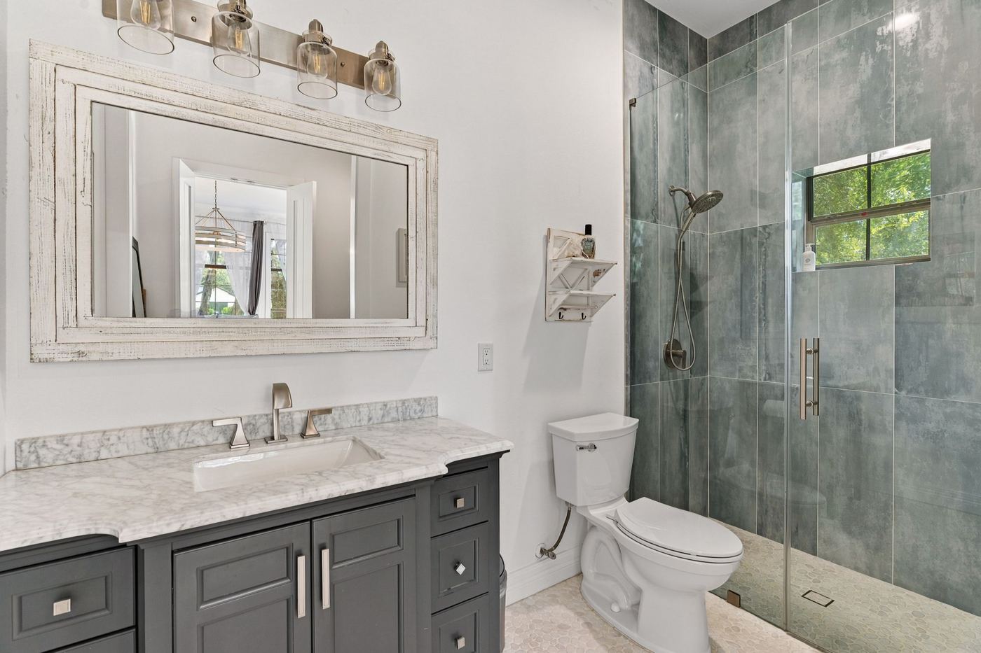 Bath with slate-tiled glass shower
