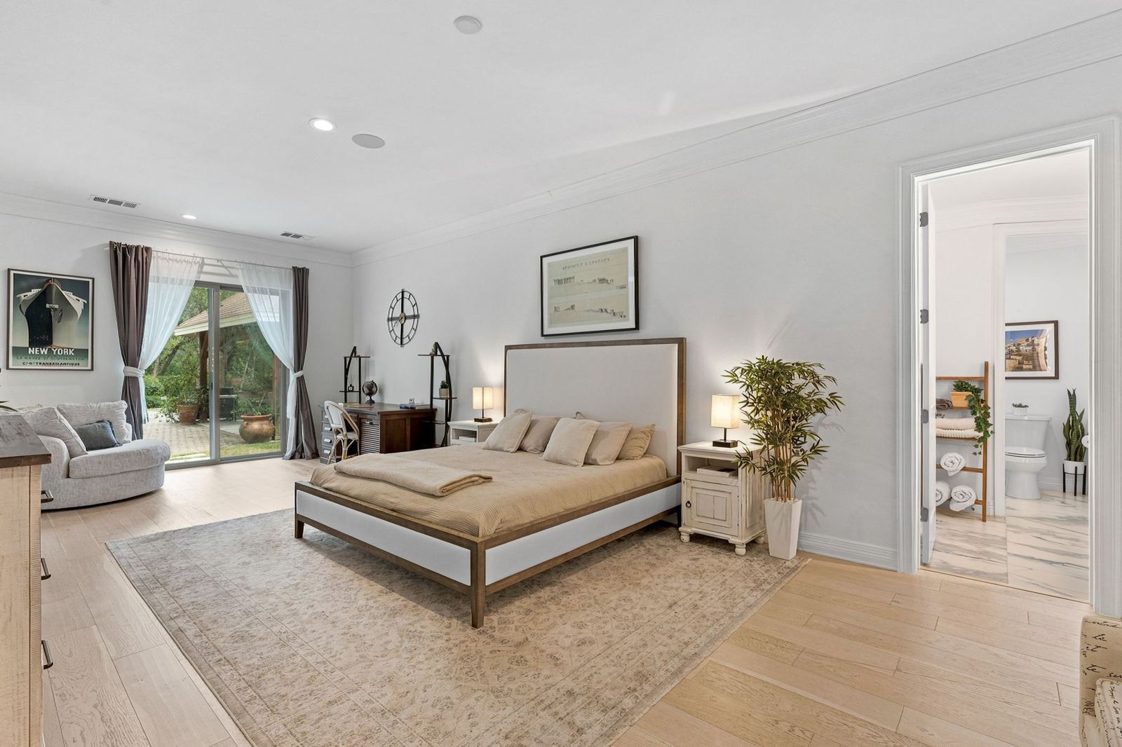 Primary suite with sitting area and garden doors