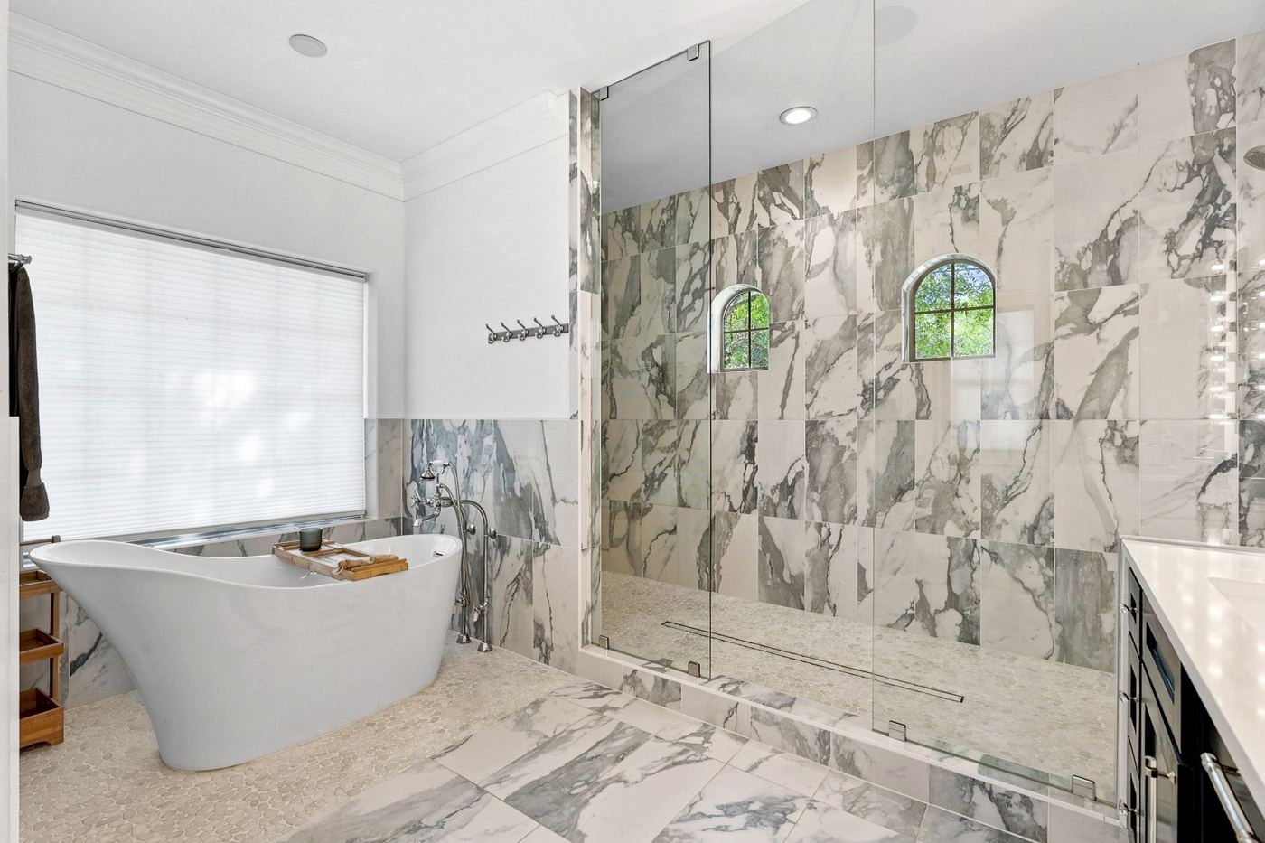 Marble spa bath with freestanding tub and glass shower