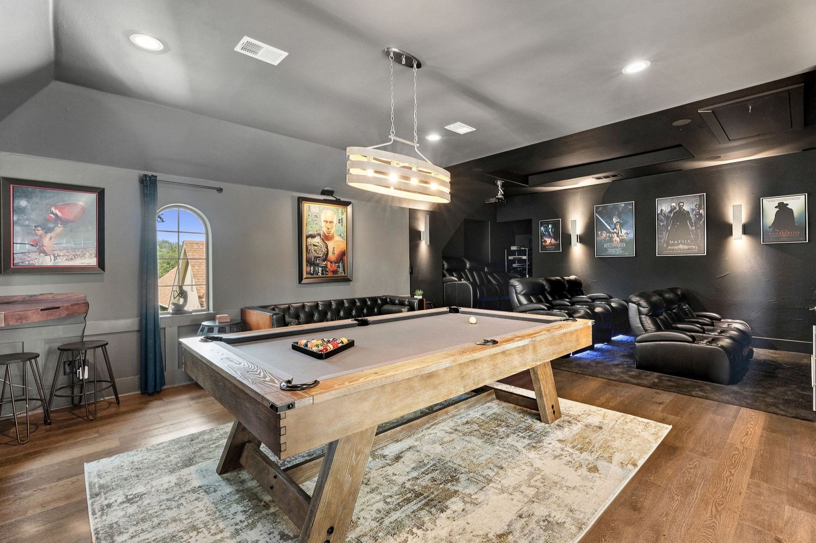 Game room with billiards table and lounge seating